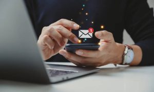 url Hand of businessman using smartphone for email with notification alert, Online communication concept.